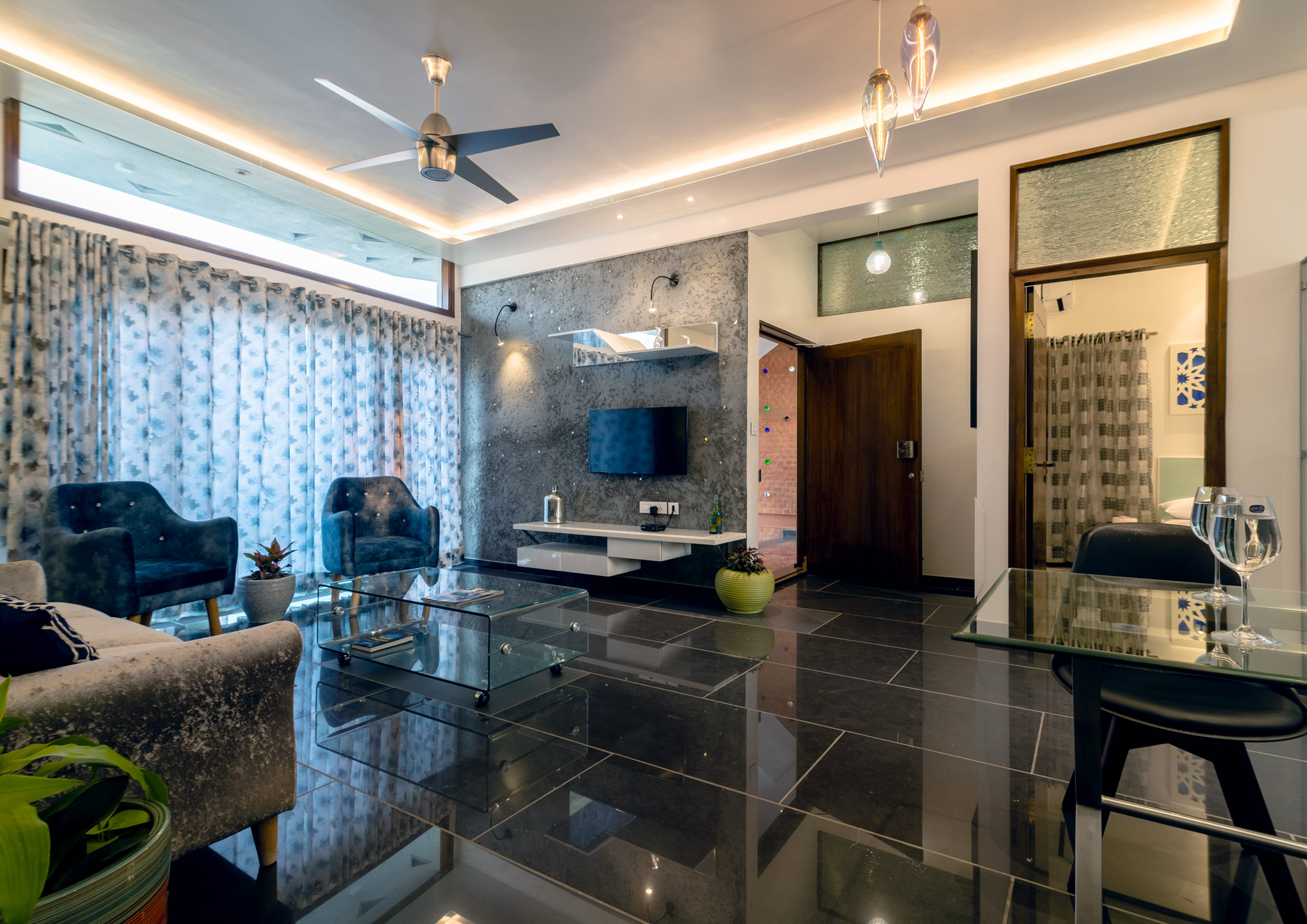 The living and diniing room of the Metal Apartment at the Jazminn, luxury service apartments for rent in Bangalore