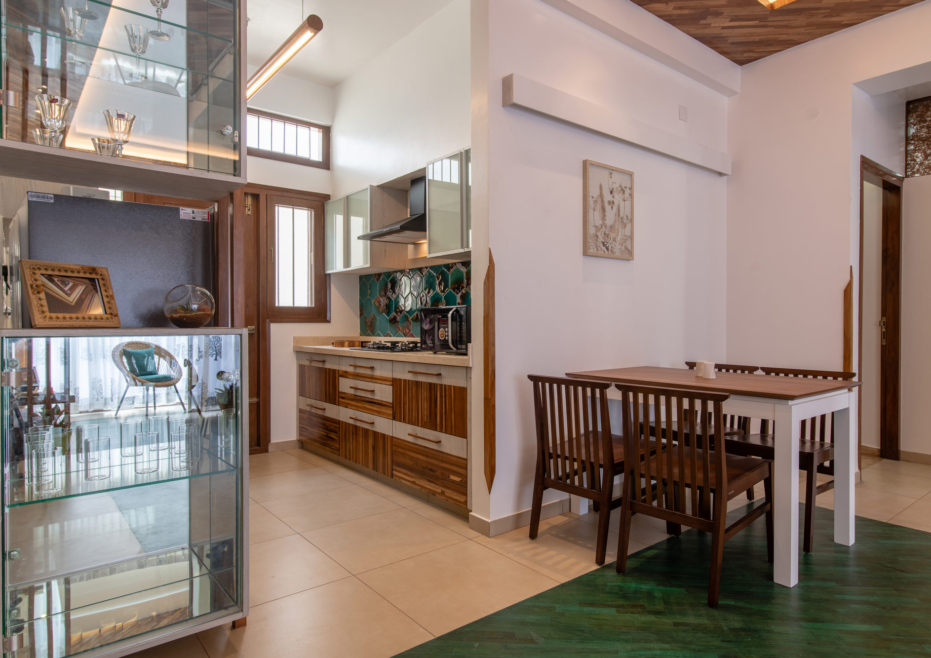 The Wood apartment's dining room and kitchen in the Jazminn, luxury service apartments in Kalyan Nagar